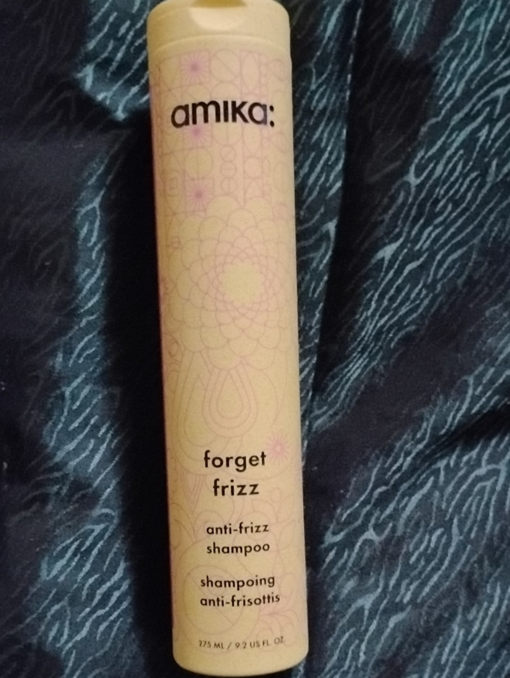 amika Forget Frizz Anti-Frizz Shampoo — pale yellow with light pink accents